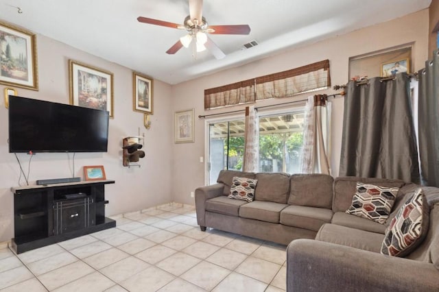 tiled living room featuring ceiling fan