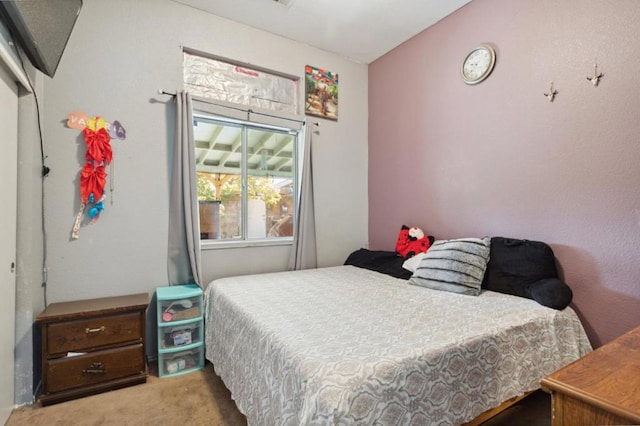 bedroom with light carpet