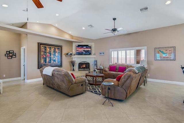 tiled living room featuring ceiling fan and vaulted ceiling