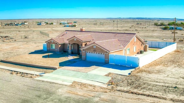 view of front of home featuring a rural view and a garage