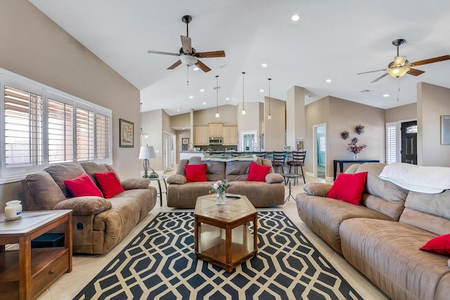 living room with ceiling fan, high vaulted ceiling, and light tile patterned flooring