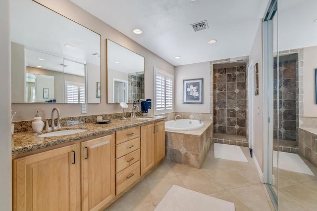 bathroom with vanity, tile patterned flooring, and independent shower and bath