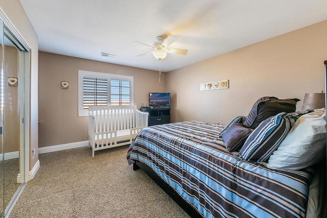 bedroom featuring ceiling fan, carpet flooring, and a closet