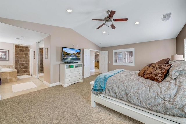 carpeted bedroom featuring ceiling fan, multiple windows, ensuite bathroom, and lofted ceiling