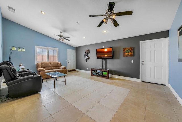 living room with ceiling fan, light tile patterned floors, and lofted ceiling