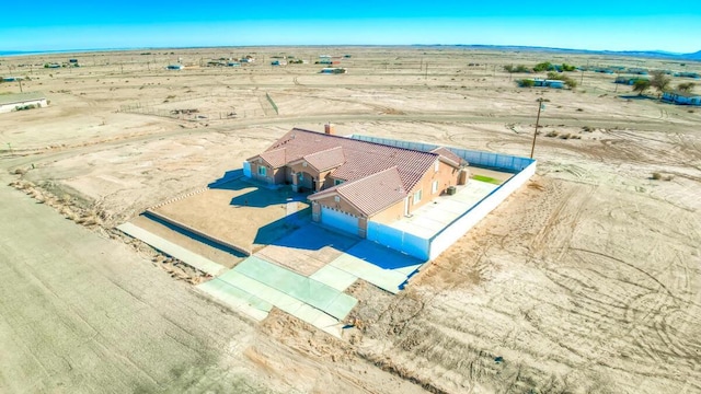 birds eye view of property with a rural view