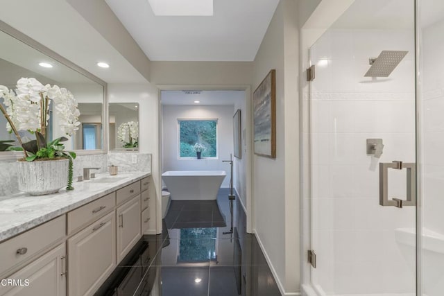 full bathroom featuring tile patterned floors, vanity, toilet, and independent shower and bath