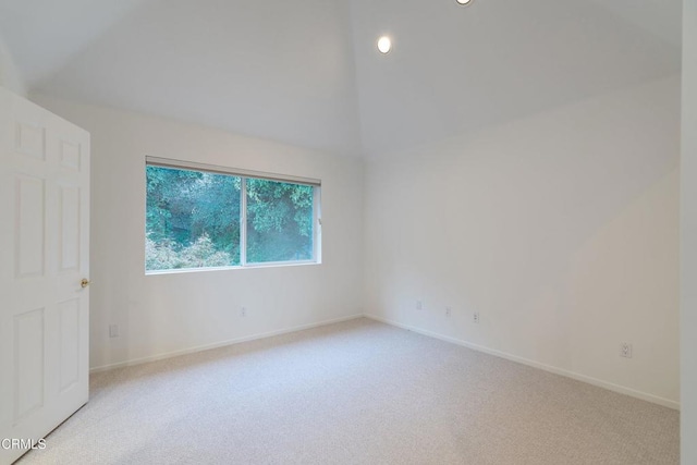 unfurnished room featuring light carpet