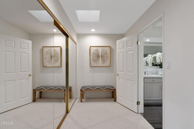 interior space with vanity and a skylight