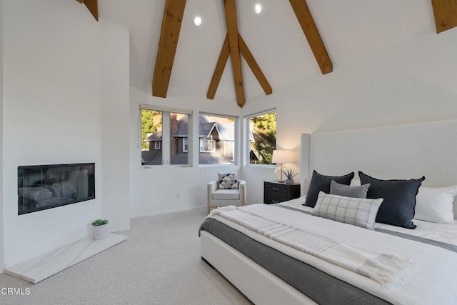 bedroom with carpet, high vaulted ceiling, and beamed ceiling