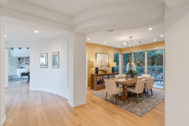 dining space with light hardwood / wood-style flooring