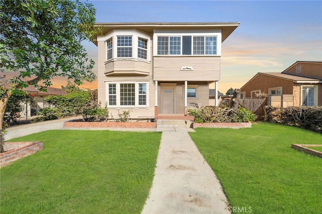 view of front of property with a yard