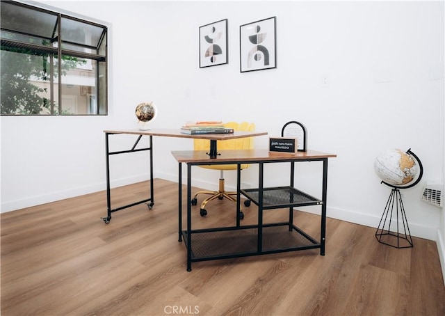 office with wood-type flooring