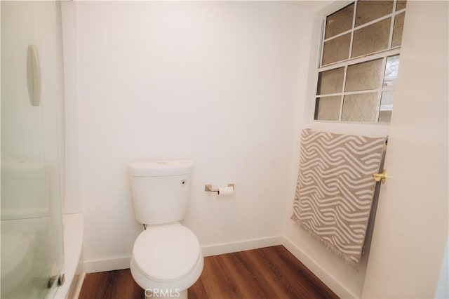 bathroom with wood-type flooring and toilet