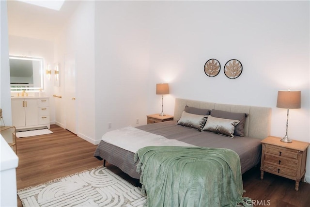 bedroom with wood-type flooring