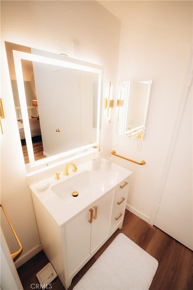 bathroom featuring vanity and wood-type flooring