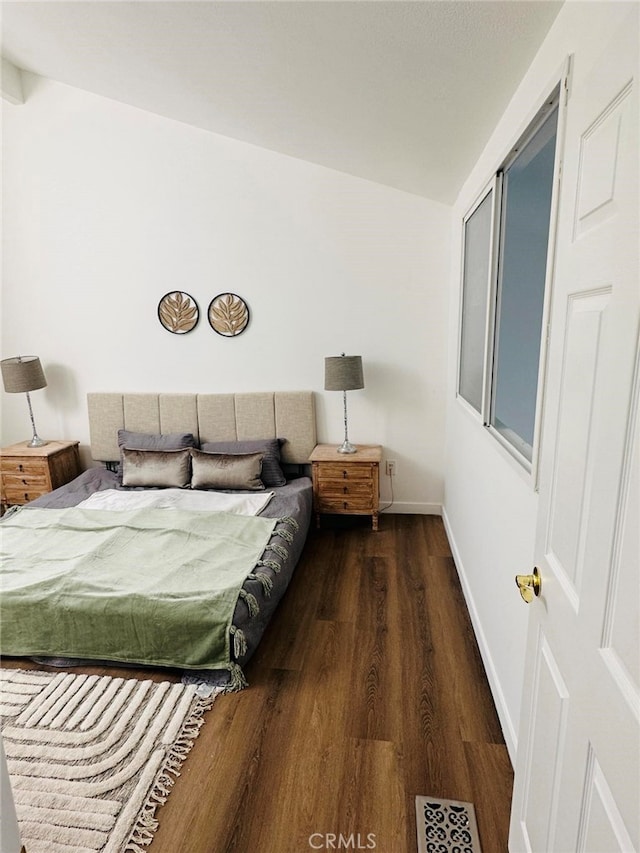 bedroom featuring dark wood-type flooring