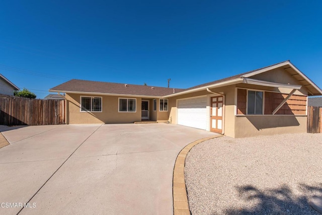 ranch-style home featuring a garage