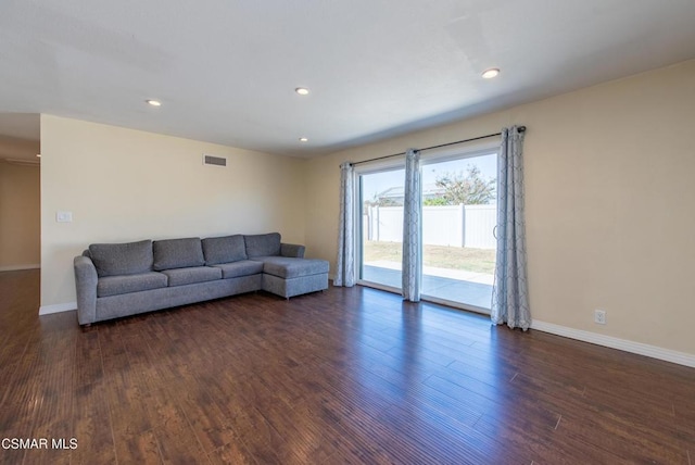 living room featuring dark wood-type flooring