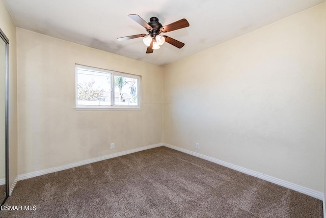 empty room featuring carpet and ceiling fan