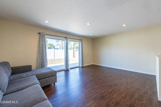 living room with dark hardwood / wood-style floors