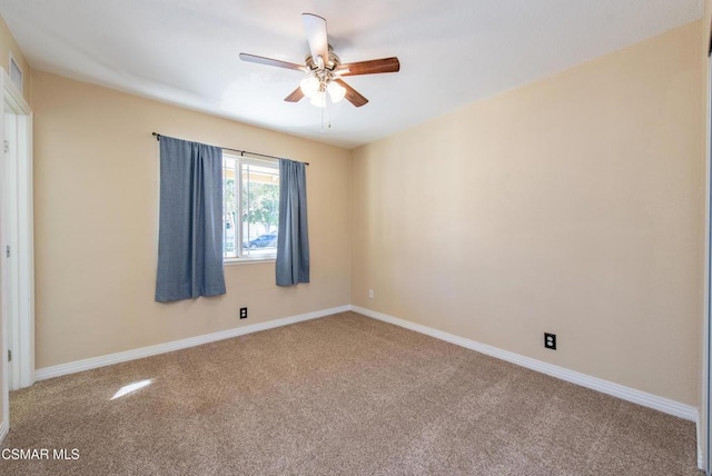 carpeted empty room with ceiling fan