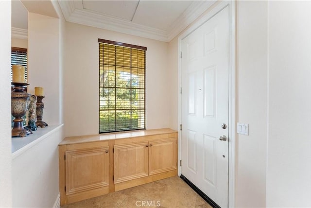 entryway featuring ornamental molding