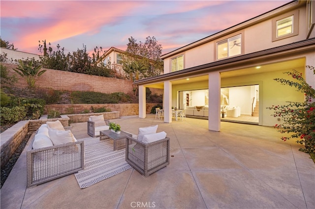 patio terrace at dusk with an outdoor hangout area