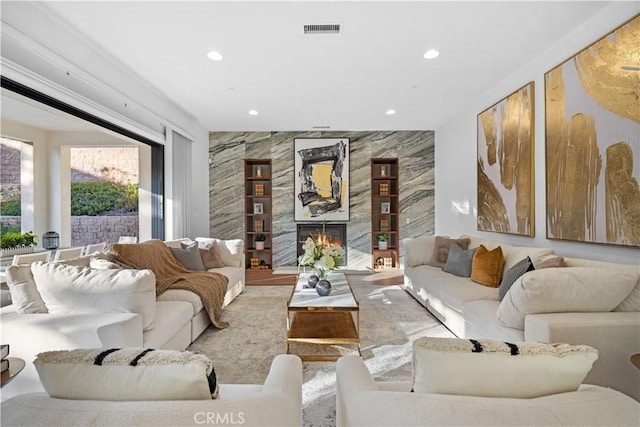 living room with a fireplace and light hardwood / wood-style floors