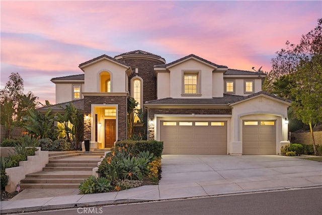 view of front of property with a garage