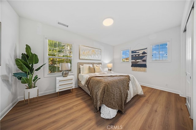 bedroom featuring dark hardwood / wood-style floors