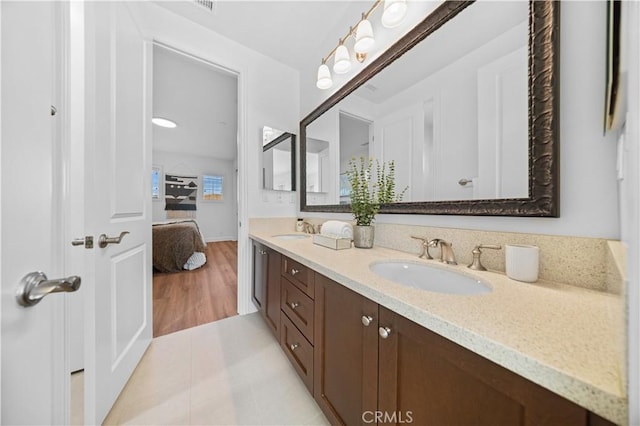 bathroom with vanity and wood-type flooring