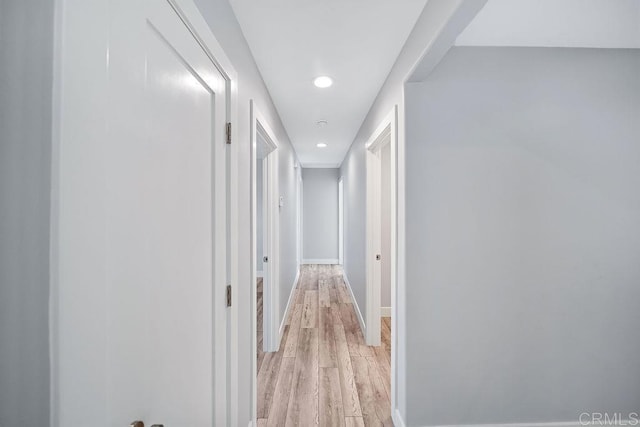 corridor with light wood-type flooring