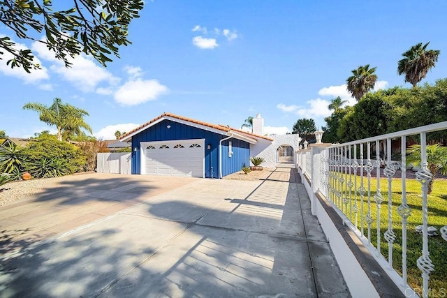 view of property exterior featuring an outbuilding and a garage