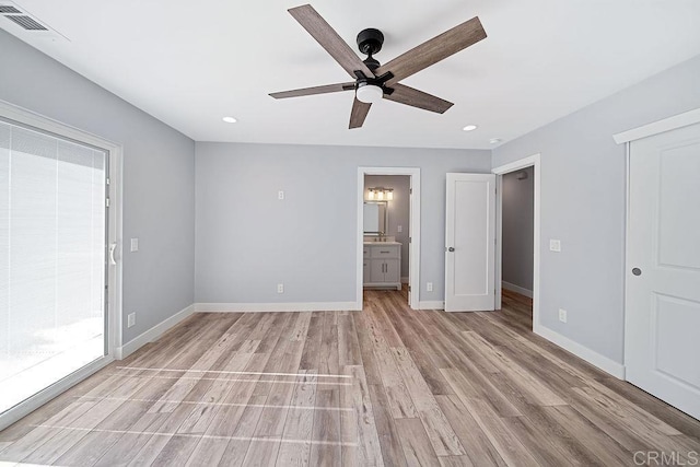 unfurnished bedroom featuring access to outside, ensuite bath, ceiling fan, and light wood-type flooring