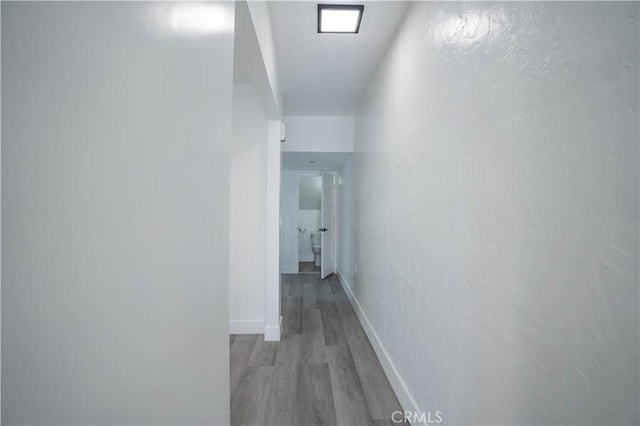 corridor featuring light hardwood / wood-style floors