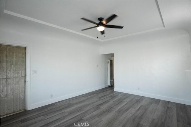 spare room featuring ceiling fan and dark wood-type flooring