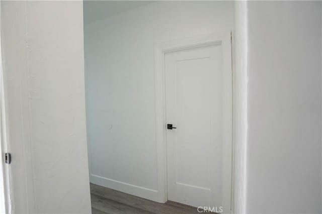 hallway with light hardwood / wood-style floors