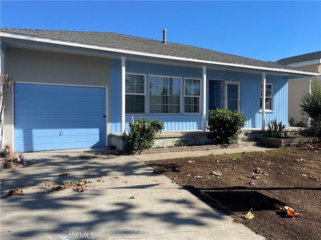 single story home with a garage