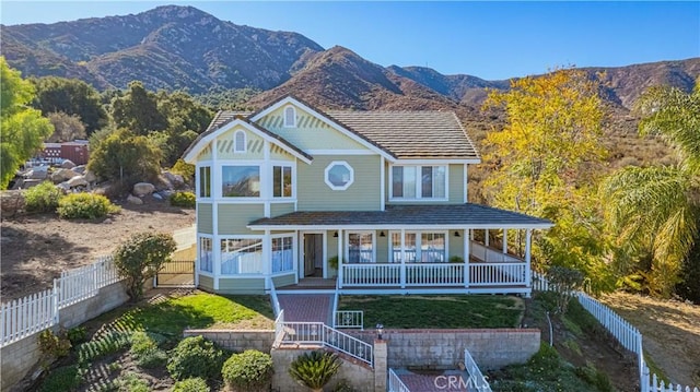 view of front of house with a mountain view and covered porch