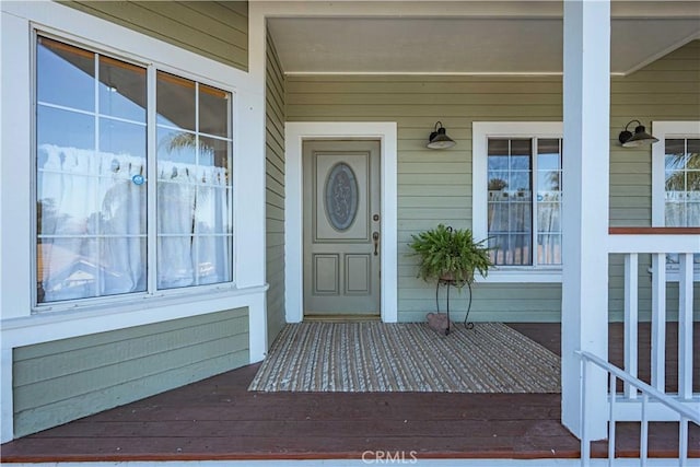 doorway to property with a porch