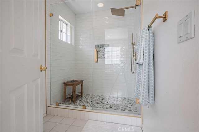 bathroom featuring tile patterned floors and an enclosed shower