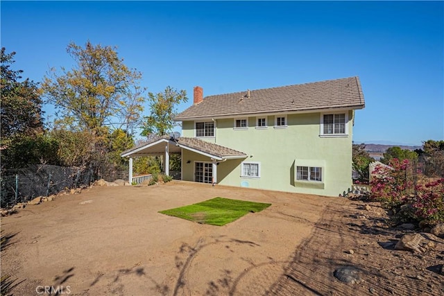 rear view of house featuring a patio