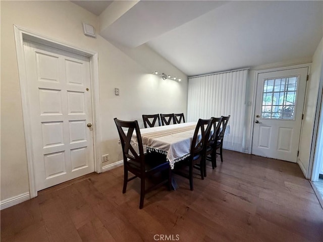 dining area with lofted ceiling and dark wood-type flooring