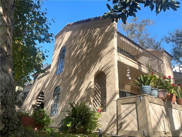 view of home's exterior with a balcony