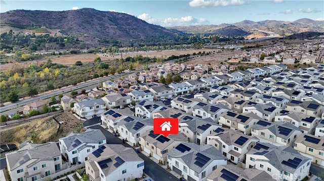 birds eye view of property with a mountain view