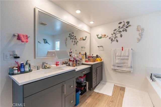 bathroom featuring hardwood / wood-style floors and vanity