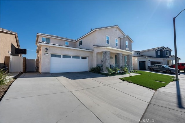 view of front of house featuring a front lawn and a garage