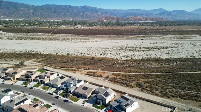 drone / aerial view featuring a mountain view