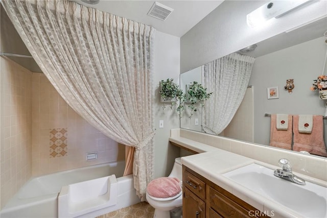 full bathroom with toilet, vanity, and shower / tub combo